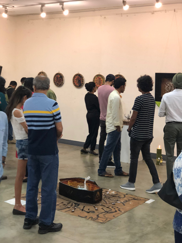 A crowd of art Connoisseurs at Humpty Dumpty Meets God by Spiritual Artist Tarun Cherian 